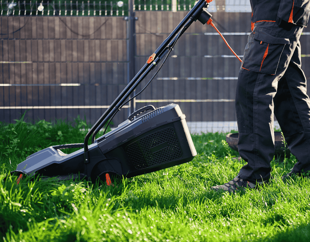 Crew providing scheduled lawn mowing and edging for a Forsyth, GA residential property on a sunny afternoon