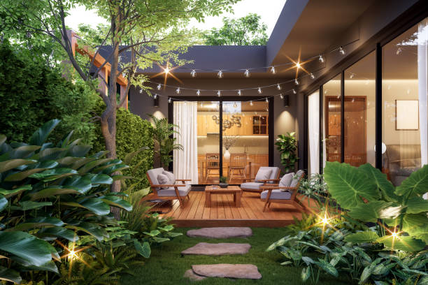 Designer reviewing plans for a multi-level deck and garden lounge in a Forsyth, GA neighborhood
